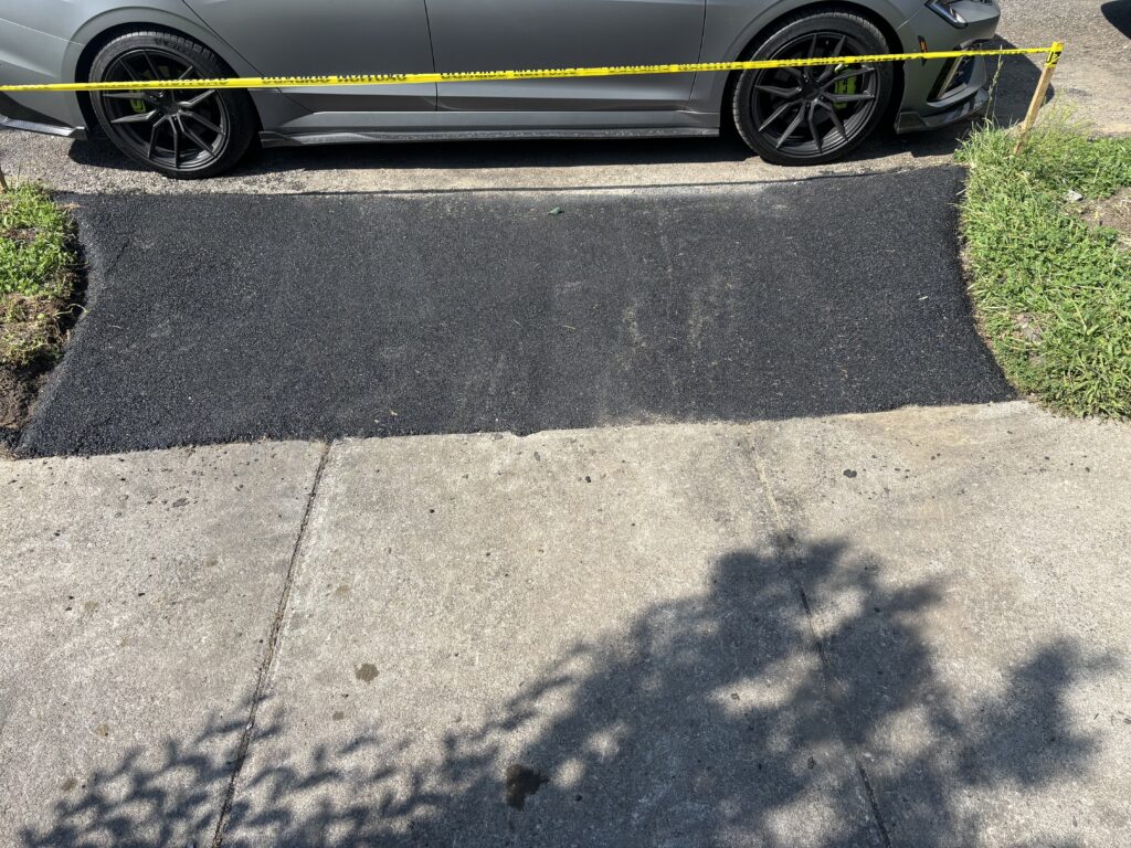 Home Finished asphalt driveway replacement in Rochester NY